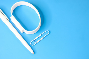 Office, school different supplies isolated on blue background.