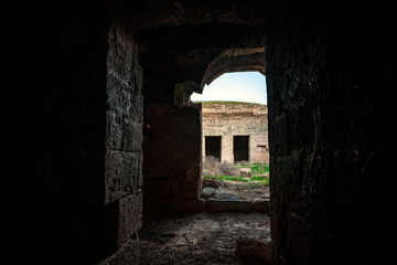 Fototapeta na wymiar Ruins of an ancient caravanserai of the 14th century, located in the Gobustan steppes, Azerbaijan