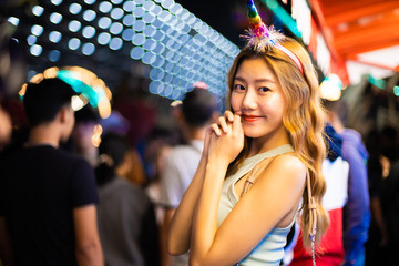 Traveler Asian blogger women travel in Bangkok, Thailand, beautiful female using .Beautiful smiling tourist young  woman having fun at amusement park at hot summer day trip.