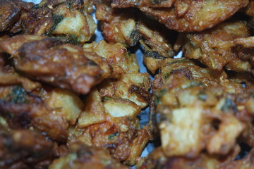 close-up view with selective focus of crispy basin pakora/pakoda or patties