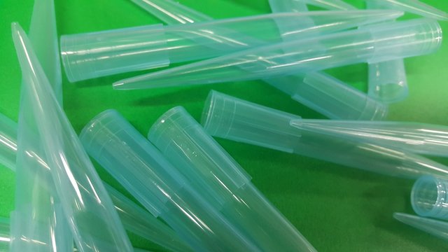 Close up view of micro litre tips on green floor