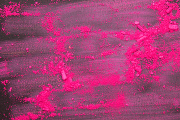 This is a photograph of a Pink powder eyeshadow isolated on a Black background