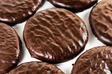 Chocolate glazed cookies on a white background