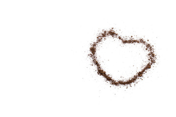 The soil on a white background with a heart shape conveys love and care.
