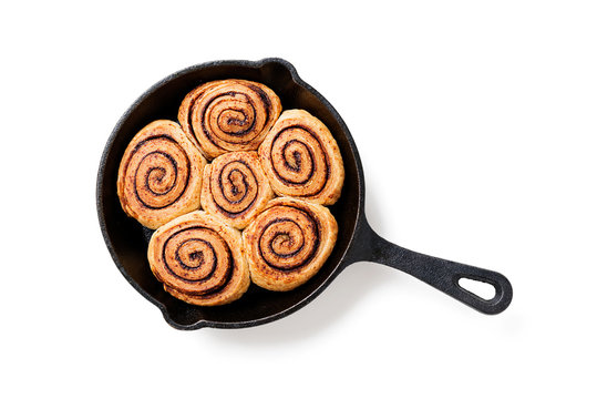 Cinnamon Rolls Baked in a Cast Iron Skillet. isolated on white background