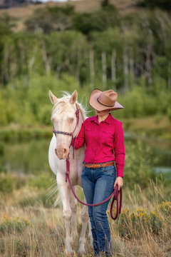 cowgirl with white horse