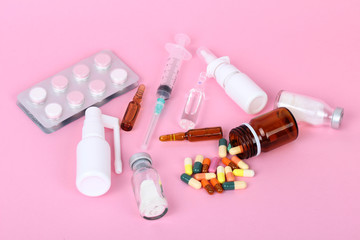 medical bottles isolated on pink background, drugs and