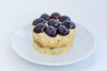 The legendary Tiffany layered salad with grapes, chicken and cheese on the white background.