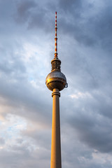 The Berliner Fernsehturm (Berlin TV Tower) with storm clouds background