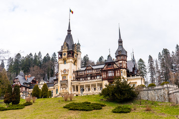 Fototapeta premium Peles castle and Pelisor castle late morning during spring season . One of the most beautiful classical Art Nouveau castle in Sinaia , Transylvania , Romania