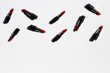 Flat lay composition, Lipsticks on white background with shadow. Beautiful Make-up concept