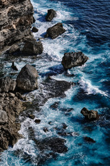Aerial view to sea landscape, water with waves and rocks. Dramatic colors photo.