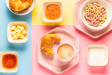 Coffee and croissants on a bright trendy background