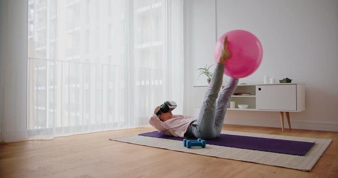 Young Caucasian woman gymnastics training with the help of Virtual Reality goggles 
