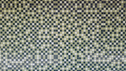 Green Mosaic Wall which made of different hues in green tiles for the design of pattern background.