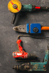 Construction worker tools on a dark background top view