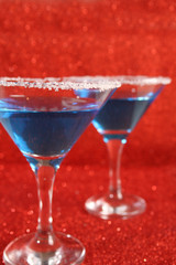 Two glasses with blue drinks