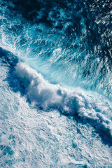 Aerial view to waves in ocean Splashing Waves. Blue clean wavy sea water.