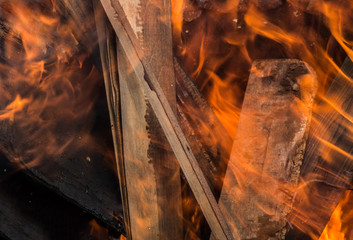 Burning boards in a bright flame
