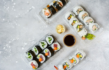 delivery food. Sushi Set nigiri, rolls overhead japanese sushi. Maki and rolls with tuna, shrimp, crab and avocado. Top view of assorted sushi, uramaki, hosomaki and nigiri. Selective focus