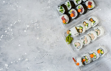 delivery food. Sushi Set nigiri, rolls overhead japanese sushi. Maki and rolls with tuna, shrimp, crab and avocado. Top view of assorted sushi, uramaki, hosomaki and nigiri. Selective focus