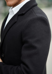 young man in black coat over white shirt mockup copyspace