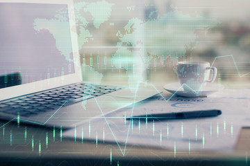 Forex graph hologram on table with computer background. Double exposure. Concept of financial markets.