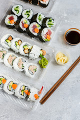 delivery food. Sushi Set nigiri, rolls overhead japanese sushi. Maki and rolls with tuna, shrimp, crab and avocado. Top view of assorted sushi, uramaki, hosomaki and nigiri. Selective focus