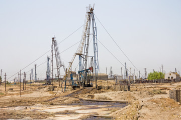 Oil pump pumping oil in former oil fields. Equipment of the oil industry Baku, Azerbaijan