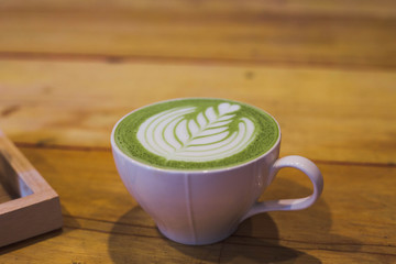 cup of coffee on wooden table