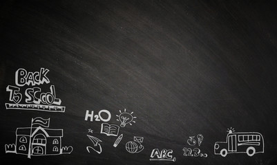 back to school , written on a blackboard.