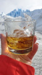 Whisky with ice from Perito Moreno glacier, Argentina. Glaciares National Park, Patagonia, Argentina.