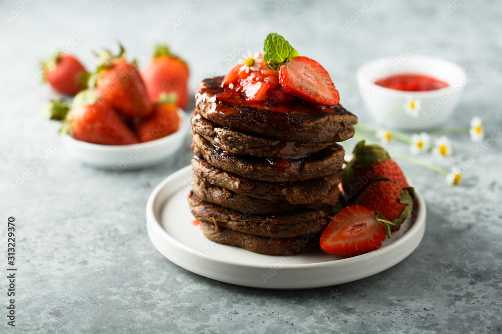 Sticker homemade chocolate pancakes with strawberry sauce