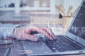 Double exposure of stock market graph with man working on laptop on background. Concept of financial analysis.