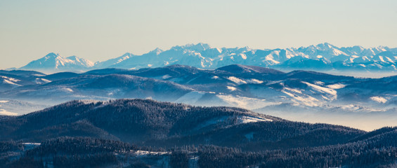 Belisnske Tatry, Vysoke Tatry and part of Zapadne Tatry mountains from Lysa hora hill in winter Moravskoslezske Beskydy mountains in Czech republic