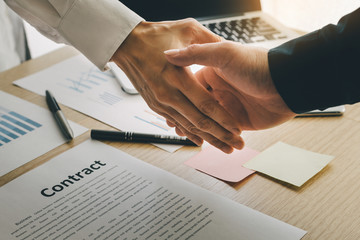 closeup.handshake business partners agree to contract Real Estate Venture International trade,contract investment in meetings vision to invest for profit. © panitan