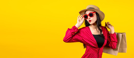 Banner of trendy shopaholic woman excited about new purchases or sales holding shopping bags and...