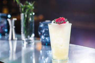 Cocktail with cranberries on the bar