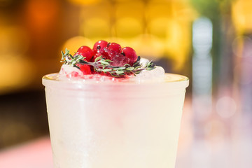 Cocktail with cranberries on the bar