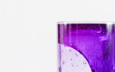 Purple lava lamp on white background