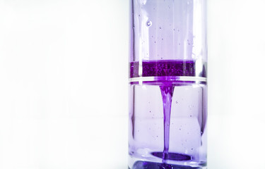 Purple lava lamp on white background