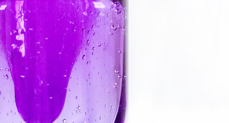 Close up of a purple lava lamp on white background