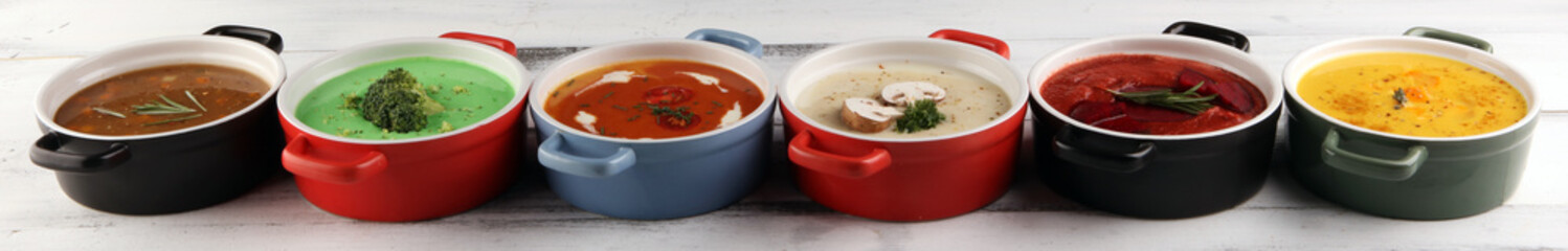 Variety of colorful vegetables cream soups and ingredients for soup. Concept of healthy eating or vegetarian food with mushrooms