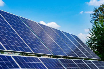 Solar panels on blue sky background