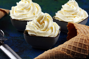 Vanilla soft served ice cream tasty sundae dairy ice cream on rustic background