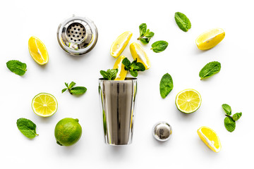 Bartender work desk with equipment and cocktail ingredietns Shaker, lime, on white background...