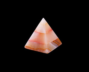 souvenir pyramid made of natural stone on white isolated background
