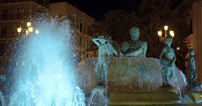 Valencia, Spain - January02,2020: View of the fountain in Plaza de la Virgen in Valencia at night.