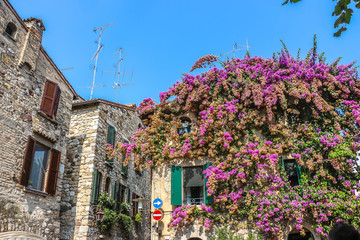 Fototapeta na wymiar Sirmione, Italy. Sunny day in beautiful town Sirmione, located on Garda lake.