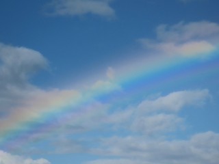 Rainbow in blue sky